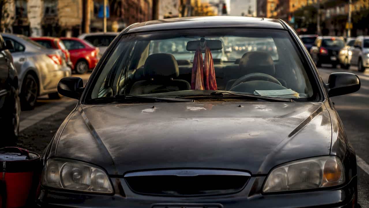 Dashboard and keys of leased car showing wear