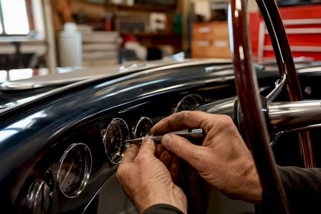 Rare Vehicle Repair Considerations for Serious Collectors 1 Hands With Classic Car Repair Tool In Garage