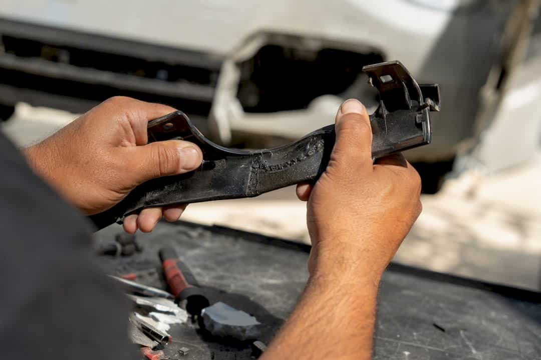 Bumper Tab Repair: Adhesive Rebuild vs Plastic Welding 2 Hands Testing Strength Of Welded Bumper Tab