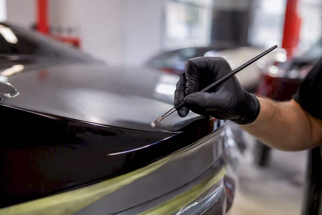 Trunk Dent Repair Cost: Realistic 2026 Price Ranges 2 Close-Up Of Paint Blending On Trunk Lid